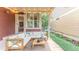 Covered patio with comfortable seating and string lights, perfect for outdoor entertaining at 8367 Devinney St, Arvada, CO 80005