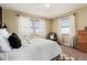 Cozy bedroom featuring neutral walls and white linens with plenty of natural light at 2257 Deerpath Rd, Franktown, CO 80116