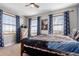 Bright bedroom with large windows, a dresser, and fun artwork at 2257 Deerpath Rd, Franktown, CO 80116