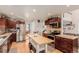 Spacious kitchen featuring modern appliances, butcher block island and ample cabinet space, perfect for cooking at 2257 Deerpath Rd, Franktown, CO 80116