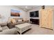 Cozy living room with comfortable seating and a large television at 2257 Deerpath Rd, Franktown, CO 80116
