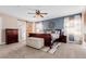 This main bedroom boasts a sleek ceiling fan and decoratively painted accent wall at 2257 Deerpath Rd, Franktown, CO 80116