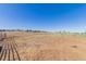 A large pasture, ideal for livestock or recreational use, surrounded by fencing, is shown in this image at 2257 Deerpath Rd, Franktown, CO 80116