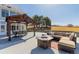Outdoor living includes a gazebo with dining, fire pit, and comfortable lounge seating at 2257 Deerpath Rd, Franktown, CO 80116