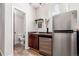 Basement wet bar featuring stainless steel appliances and unique shelving at 2257 Deerpath Rd, Franktown, CO 80116