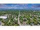 Aerial view of the area highlighting the house and nearby leafy trees in a quiet neighborhood setting at 211 E Emma St, Lafayette, CO 80026