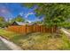 View of the backyard with wooden fence and surrounding nature at 211 E Emma St, Lafayette, CO 80026