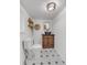 Charming bathroom with hexagon tile floor and rustic wooden vanity at 211 E Emma St, Lafayette, CO 80026