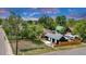 Charming home featuring dark siding, a well-maintained yard, Airstream trailer, and a wooden fence at 211 E Emma St, Lafayette, CO 80026