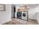 Modern laundry room with stainless steel appliances, storage, and stylish decor, offering convenience and functionality at 211 E Emma St, Lafayette, CO 80026