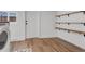 Well-equipped laundry room featuring modern appliances and ample storage space, enhancing convenience and organization at 211 E Emma St, Lafayette, CO 80026