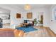 Bright living room with hardwood floors, stylish decor, and an inviting atmosphere for relaxation and entertainment at 211 E Emma St, Lafayette, CO 80026