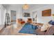 Cozy living room featuring hardwood floors, neutral walls, and stylish decor at 211 E Emma St, Lafayette, CO 80026