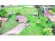 Aerial view of home with a large yard, mature trees, and a boat in the backyard at 5870 Nelson Ct, Arvada, CO 80004
