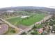 Aerial view of a large park with sports fields, a pond, and surrounding neighborhood at 5870 Nelson Ct, Arvada, CO 80004