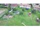 Spacious backyard featuring a large grassy area, storage shed, and fencing at 5870 Nelson Ct, Arvada, CO 80004