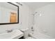 Clean bathroom featuring a shower-tub combo, vanity, and sleek fixtures at 336 N Grant St # 302, Denver, CO 80203