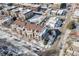 Aerial view of a residential building with brown roofs in a snow-covered neighborhood at 111 S Monroe St # B203, Denver, CO 80209