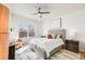Bright bedroom with a large window, modern furnishings, and neutral decor for a relaxing space at 111 S Monroe St # B203, Denver, CO 80209