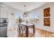 Bright dining area with large windows and stylish table setting at 111 S Monroe St # B203, Denver, CO 80209