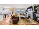 Cozy living room featuring a fireplace, comfortable seating, and natural light at 111 S Monroe St # B203, Denver, CO 80209