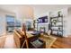 Relaxing living area with fireplace, balcony access, and stylish furnishings at 111 S Monroe St # B203, Denver, CO 80209