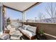 Inviting patio with seating area and view of the neighborhood at 111 S Monroe St # B203, Denver, CO 80209