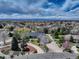 Expansive aerial view of home in quiet neighborhood, mature trees, lush landscaping and mountain views at 3997 S Dawson St, Aurora, CO 80014