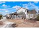 Beautiful backyard with a covered patio, landscaping, a shed, and a large grassy area at 7186 Weaver Cir, Castle Rock, CO 80104