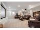 Finished basement designed for entertainment with comfortable seating, a movie screen, and a bar area at 7186 Weaver Cir, Castle Rock, CO 80104
