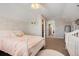 Bedroom with ceiling fan, a peek to the walk in closet, and soft and elegant decor at 7186 Weaver Cir, Castle Rock, CO 80104