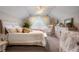 Comfortable bedroom with sloped ceilings, crib, rocking chair and a large window at 7186 Weaver Cir, Castle Rock, CO 80104