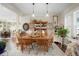 Elegant dining room featuring a classic table set, wood chairs and lots of natural light at 7186 Weaver Cir, Castle Rock, CO 80104
