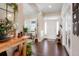 Inviting foyer with hardwood floors, natural light, and an elegant entryway at 7186 Weaver Cir, Castle Rock, CO 80104