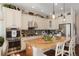 Beautiful kitchen with granite countertops, stainless steel appliances, and designer tile backsplash at 7186 Weaver Cir, Castle Rock, CO 80104