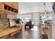 Open-concept living space featuring hardwood floors, large windows, and modern decor at 7186 Weaver Cir, Castle Rock, CO 80104