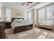 Light-filled main bedroom boasts tray ceiling, lots of windows with shutters, and ample storage at 7186 Weaver Cir, Castle Rock, CO 80104