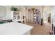 Bright office featuring a large bookshelf, workspace and access to the upstairs area at 7186 Weaver Cir, Castle Rock, CO 80104
