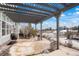 Covered patio with an outdoor dining set and scenic views, creating a cozy and inviting outdoor space at 7186 Weaver Cir, Castle Rock, CO 80104
