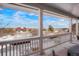 Covered porch with views of the surrounding landscape and blue sky at 7186 Weaver Cir, Castle Rock, CO 80104