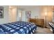 Bedroom features a desk and chair and a large window for natural light at 8300 Fairmount Dr # Aa102, Denver, CO 80247