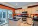 Efficient kitchen with stainless steel appliances, granite countertops, and adjacent sliding glass door to the patio at 8300 Fairmount Dr # Aa102, Denver, CO 80247