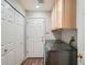 Laundry room with washer and dryer, shelving and a utility sink at 8300 Fairmount Dr # Aa102, Denver, CO 80247