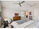 Spacious main bedroom features a ceiling fan, a dresser, and a rower for fitness at 8300 Fairmount Dr # Aa102, Denver, CO 80247