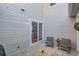 Private patio featuring sleek chairs, a table, and access to the home through sliding glass doors at 8300 Fairmount Dr # Aa102, Denver, CO 80247