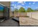 Private fenced backyard with deck and mulched garden beds, ideal for relaxing or entertaining at 1160 S Clinton St # 40, Denver, CO 80247