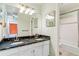 This relaxing bathroom features a double vanity, spacious mirror and bathtub at 1160 S Clinton St # 40, Denver, CO 80247