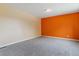 Spacious bedroom with two-tone walls, plush carpet, and base trim at 1160 S Clinton St # 40, Denver, CO 80247