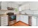 A close up view of a well-equipped kitchen with stainless steel appliances and modern finishes at 1160 S Clinton St # 40, Denver, CO 80247