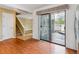 Open floor plan with hardwood floors, staircase and a sliding glass door to the deck at 1160 S Clinton St # 40, Denver, CO 80247